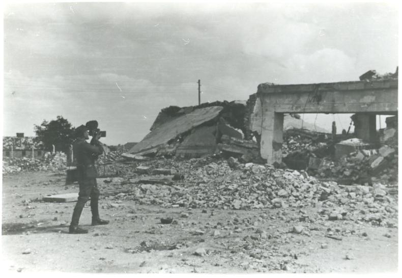 An operator filming the ruins of Krematorium II