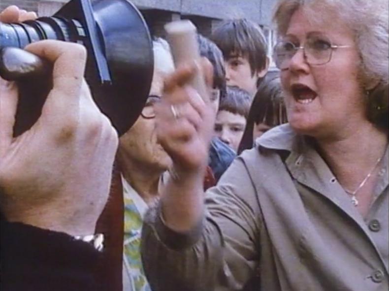 Still from ACCEPTABLE LEVELS (1983): Mrs Nolan brandishes the fatal plastic bullet.